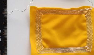 Smart textile sensor measures body movement to detect onset of fatigue