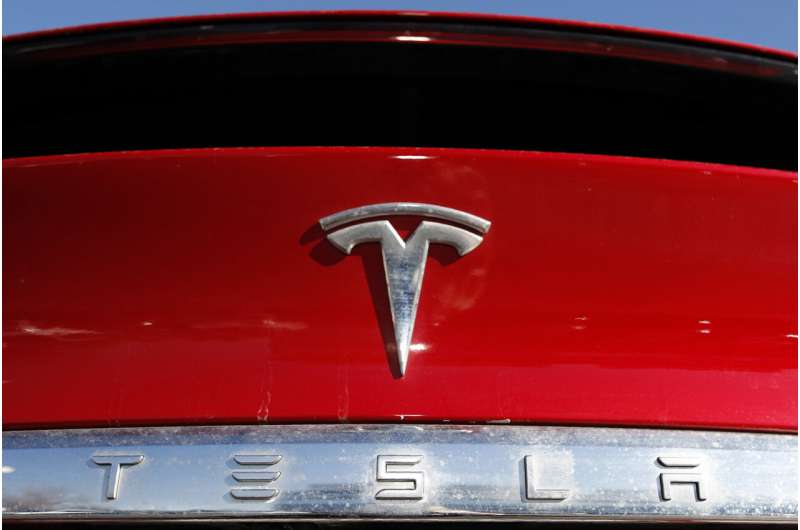 Tesla recalling nearly 2.2M vehicles for software update to fix warning lights that are too small