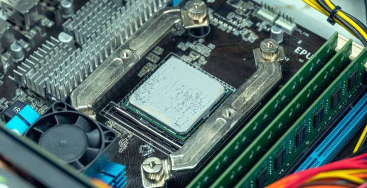 Close-up view of thermal paste application on an AMD FX 8350 processor.